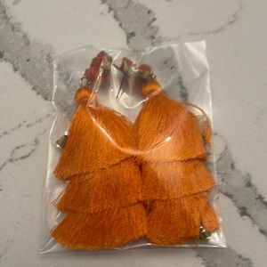 Orange tassle earrings. New, in sealed bag. Discounted shipping!